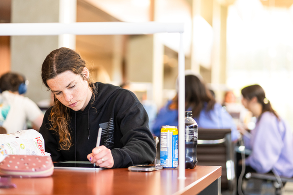 student studying at ucsb library