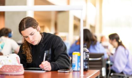 student studying at ucsb library